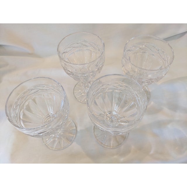 A set of four Towle crystal goblets in pattern number TOC73 displaying a chain border above arched panels on the bowl with...