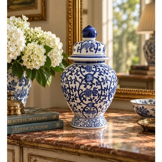A classic blue and white ginger jar, decorated throughout with delicate Chinese floral motifs. The pattern is dense yet...