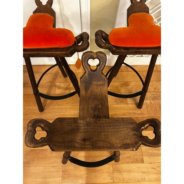 Set of three mid century Spanish brutalist bar stools. Extremely sturdy and well made. With solid metal footrests that add...