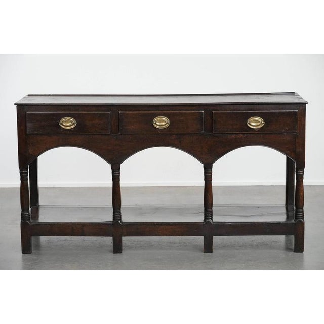 We are offering this beautiful antique 18th-century English side table/dresser made of oak with a beautiful patina. This...