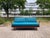 This Wilhelm Knoll Antimott Sofa features its original blue petrol wool upholstery fabric with innerspring seating and an...
