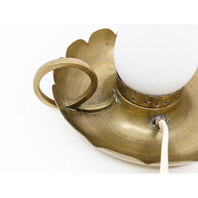 Pair of bedside lamps in brass and opaline glass in the Arredoluce style. Lamps produced in the 40s in Italy of good...