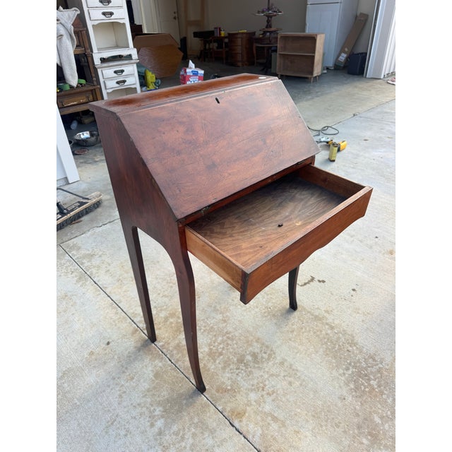 Graceful and timeless, this early-1900s slant-front secretary desk offers the charm of a bygone era in a perfectly scaled...