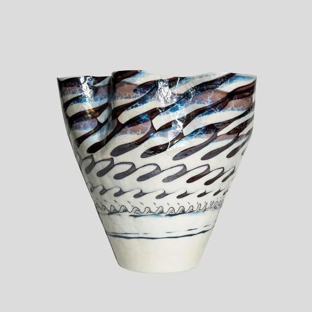 A unique blown Murano glass paste vase, iridescent off white with wavy edges and soft colours glass decor. Made in Italy....