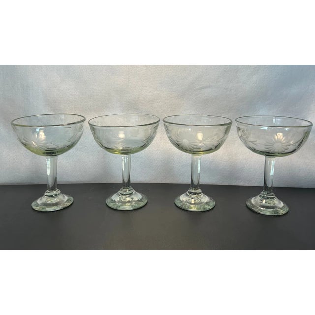 These are beautifully crafted glasses that have a tinge of green and etched flowers. Whether you like the rim salted or...