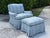 Striking vintage lounge chair and ottoman featuring a traditional skirted silhouette, blue and white checked upholstery,...
