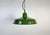 Industrial green enamel factory pendant light made in United Kingdom during the 1960s. White enamel inside the shade....