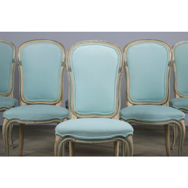 An elegant set of six Baker Furniture dining chairs in the Louis XV style, sourced from Provence, France. These chairs are...