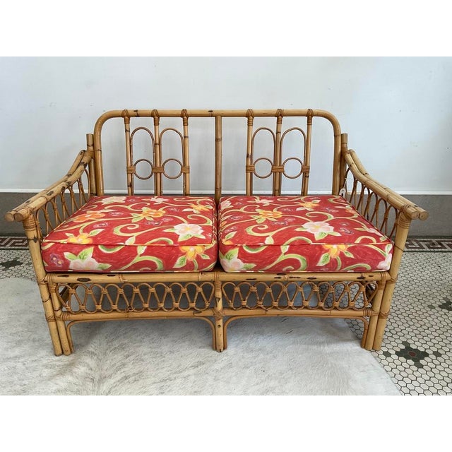 Bring a vibrant splash of vintage island style into your home with this striking mid-century modern rattan 2-seater sofa...