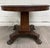 This is a striking antique American Empire mahogany pedestal round center table with carved paw feet or lion feet, likely...