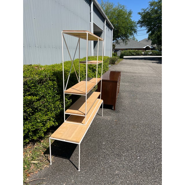 A two piece satin white iron and light toned maple wood bookcase / etagere designed by Mid Century icon Paul McCobb ....