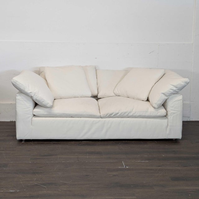 This Restoration Hardware 3-seat sofa offers a spacious and comfortable seating area with plush cushions and a clean,...