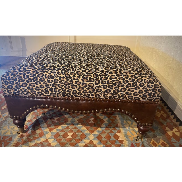 36 " Leopard Fabric Print Ottoman by Seven Seas featuring top-grain leather and German brass nails.
