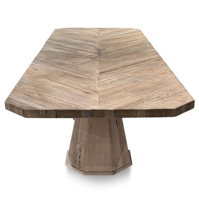 Crafted from solid reclaimed oak, this dining table pairs the warmth of naturally weathered wood with refined...