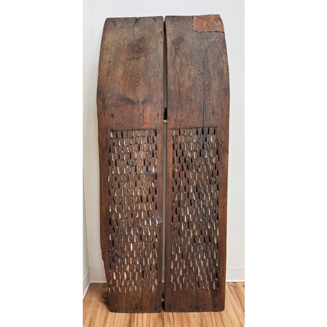 Antique 19th Century wheat thresher sledge comprised of two curved wood panels covered in hundreds of small flint blades....