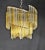 A delightful vintage chandelier from murano, in the venini style. Its shape is reminiscent of ancient woven fans. It...
