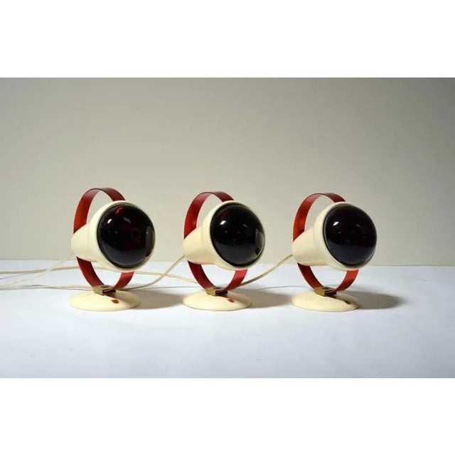 Set of three infrared wall sconces by Charlotte Perriand for Philips. Designed by Charlotte Perriand in the early 1950s....
