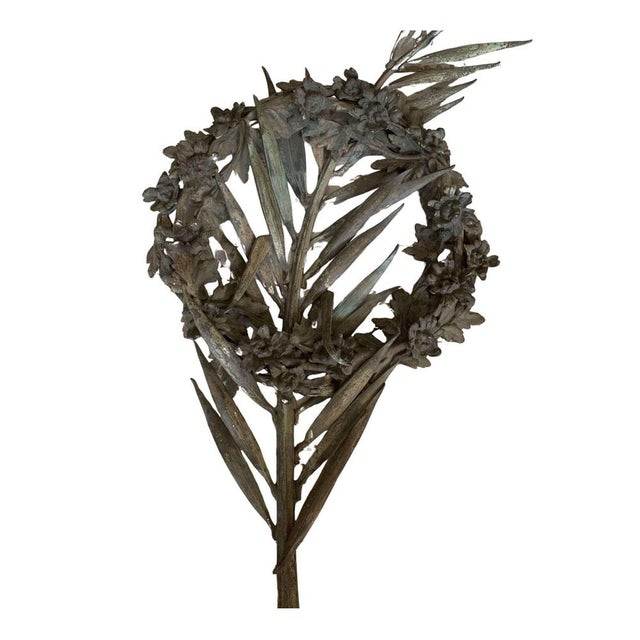 A french bronze floral wreath circa 1920s with a central stylised sprig surrounded with leaves and flowers. Possibly...