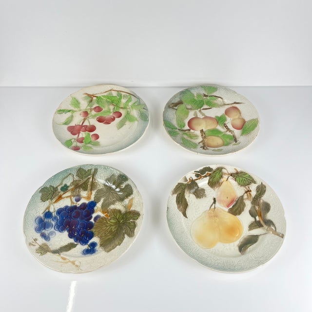 Set of 4 KG St. Clément barbotine fruit plates (cherry, mirabelle plum, grape, pear), late 19th-early 20th century...