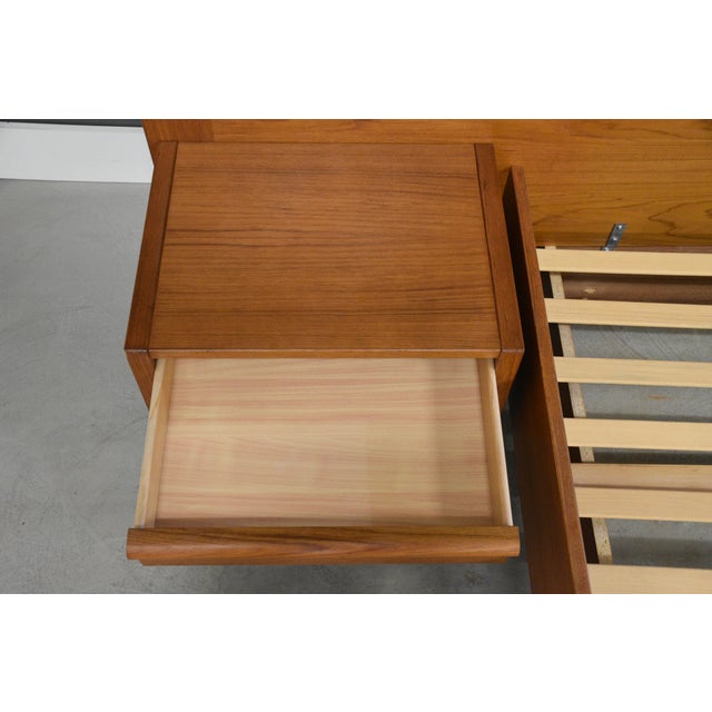 A mid century modern teak queen size platform bed with floating nightstands made by Jesper International. Made in Denmark....