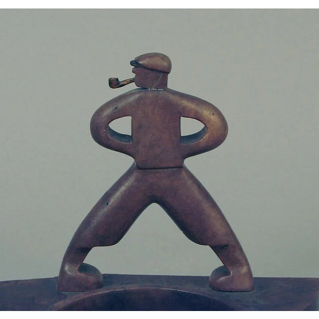 A gentleman needs his toys – no? -- and what better symbol of his masculinity and power than this pipe holder with tamp...