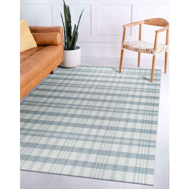 Handcrafted Vibrant Gray Flatweave Wool Rug, Country of Origin: India. This exceptional flatweave piece showcases the...