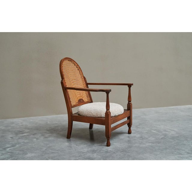 This is a lovely and comfortable lounge chair in solid oak by the Polish furniture maker 'Gościcino' from the city with...