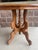 Antique Victorian Eastlake table carved porcelain wheels walnut manufactured in the 1800s dimensions are 23 1/2” x 32” x...