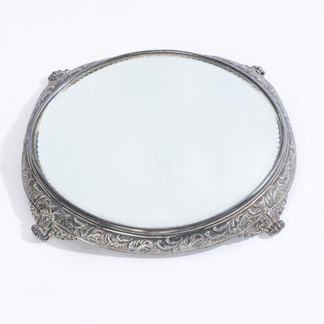 Detailed base on this plateau mirror. Great piece to help others shine. This piece is a display piece used to help display...