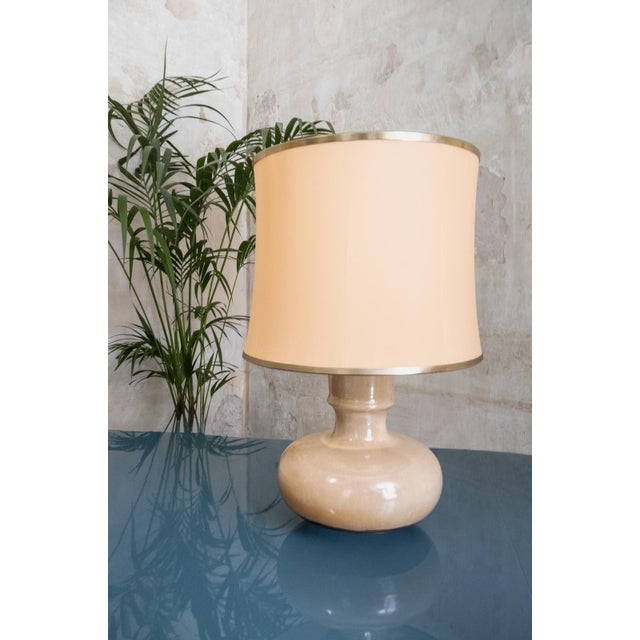 Glazed Ceramic Table Lamps – 1970s Bases crafted in glazed ceramic in two different tones, characterized by a rounded body...