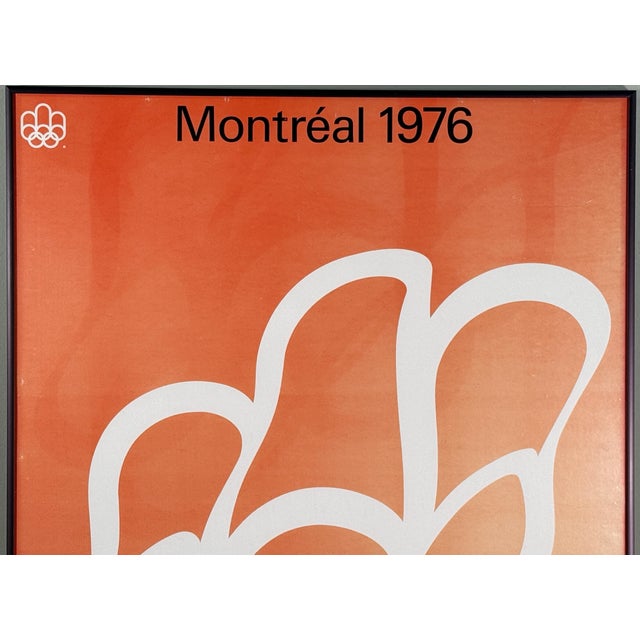 This original Montréal 1976 Olympic Games poster features a bold modernist white line emblem set against a warm orange...