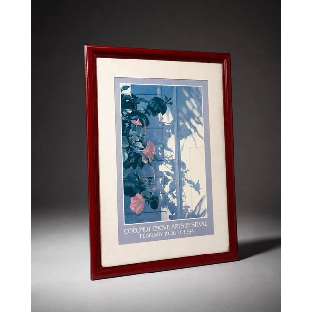 Framed vintage poster from the 1994 Coconut Grove Arts Festival in Miami, Florida. The poster features a blue-toned floral...