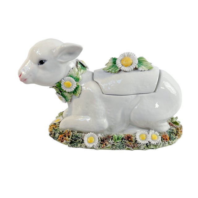 This is a charming Italian majolica lamb-form tureen by Meiselman, modeled as a recumbent lamb resting on a textured...