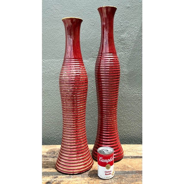 This striking pair of tall ceramic vases captures the bold energy of Postmodern design with a touch of organic texture....