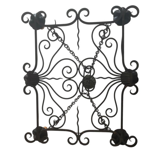 This French provincial rectangular wrought iron chandelier will look great over a kitchen island. Perfect for a great...