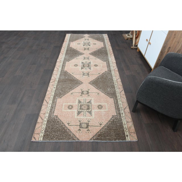 Vintage Turkish Hand-Knotted vintage rug is a semi- vintage runner rug.'70s Eastern region of Turkey's unique rug is...