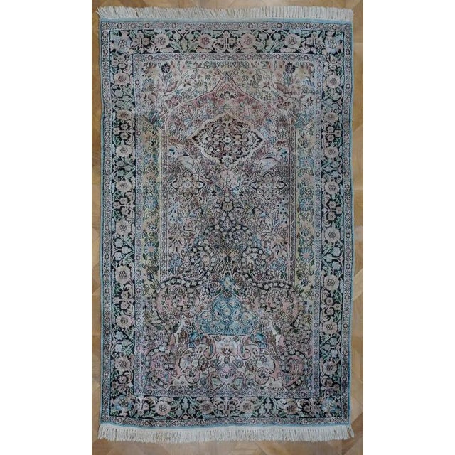 Hand-knotted rug from Kashmir with a richly elaborate Tree of Life motif. The rug is made of fine mercerized cotton on a...