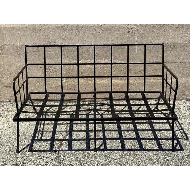 Vintage Mid Century Modern Black Wrought Iron Arthur Umanoff Style Sofa. Circa Mid 20th Century. Measurements: 26" H x 49"...