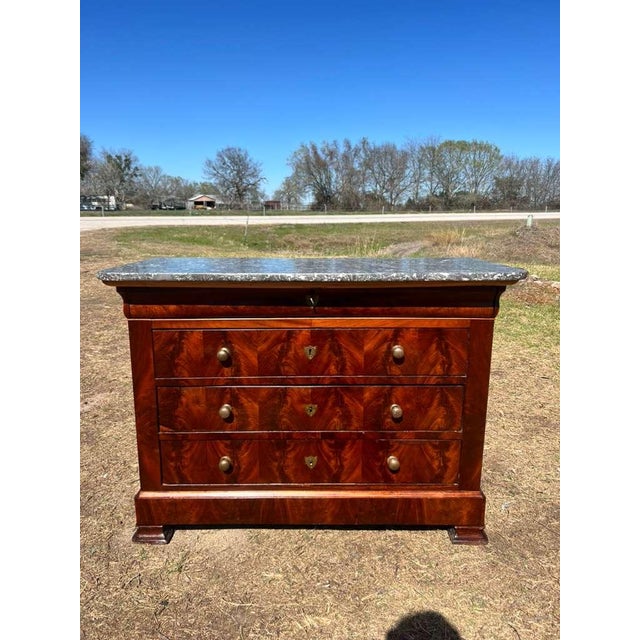 19th Century French Louis Philippe Commode from nice France. Made of Flam Mahogany, with a marble top, the wood has been...