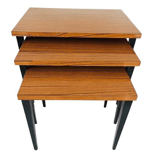 Cool mid-century Danish Design nesting set of side tables from the 1960s. This set of three nesting tables features black...