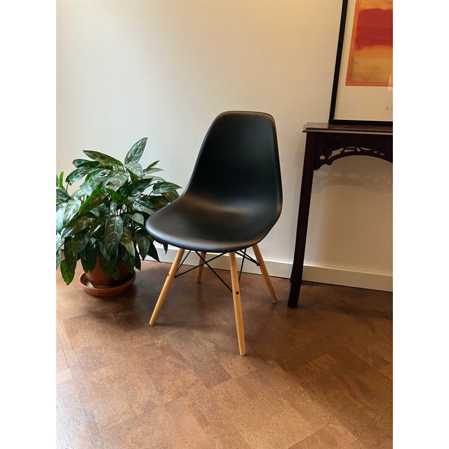 A classic of modern design, this set of four authentic Eames DSW (Dining Side Wood) chairs was produced by Herman Miller....