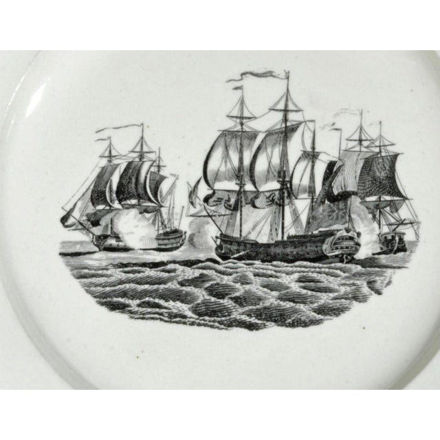 Liverpool Pearlware Naval Battle Plates, Pair, Circa 1800 A pair of Liverpool pearlware plates printed in black with a...