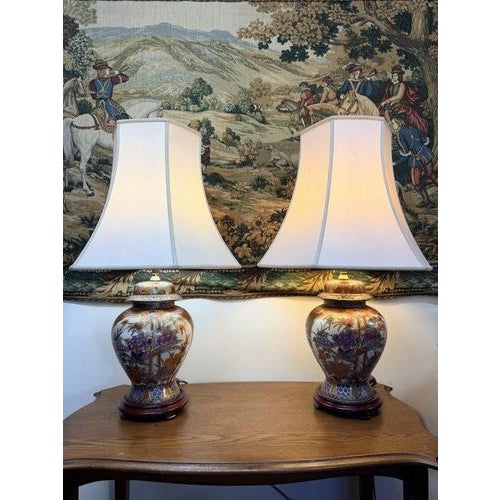 A decorative pair of Satsuma vase table lamps, each of elegant baluster shape and beautifully painted with natural...