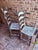 Pair of Early 20th Century Rush Seat Ladderback Side Chairs With Distressed White Chippy Paint Finish For Sale - Image 11 of 12
