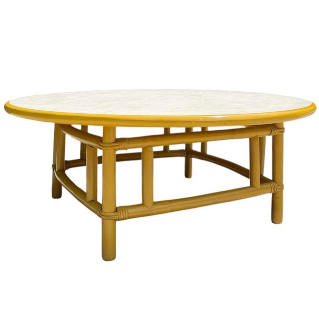 Bring timeless Palm Beach style to your space with this vintage 42-inch round bamboo coffee table, inspired by the iconic...