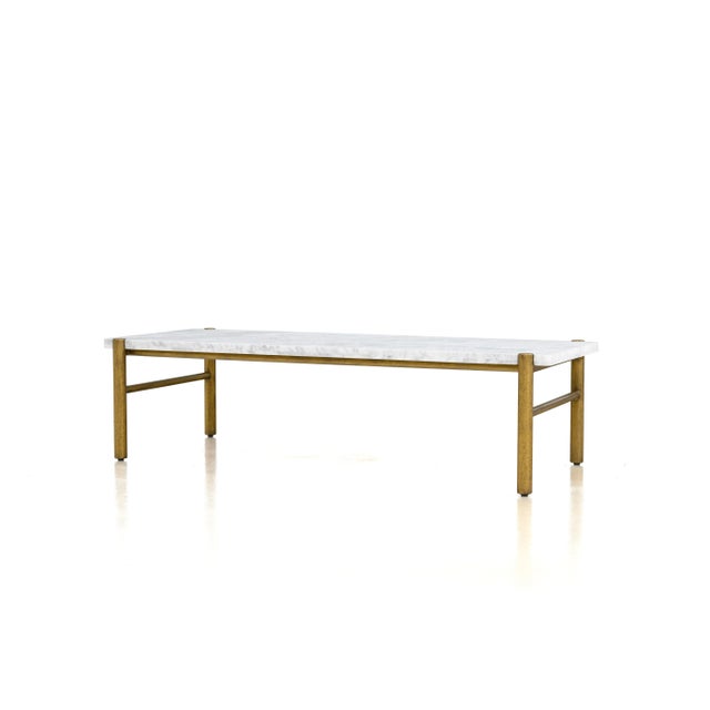 Volakas marble and brass finished cocktail table with puzzle pattern top.