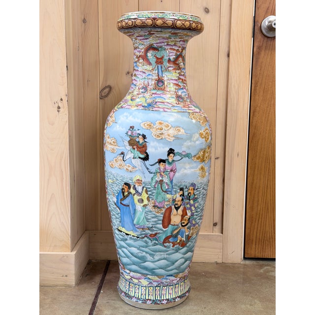 This is a magnificent large Chinese Famille Rose porcelain floor vase, richly decorated with hand painted courtly scenes...