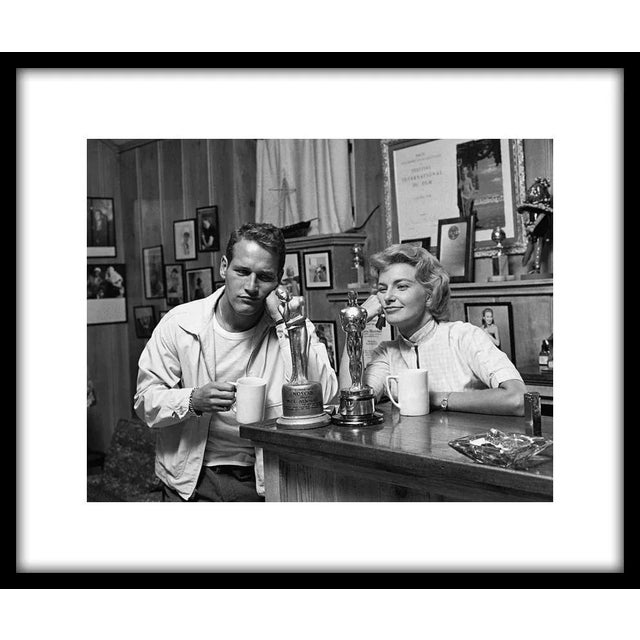Paul Newman and wife Joanne Woodward "admiring" their awards. His: Noscar for not having received an Oscar (yet) and Hers:...