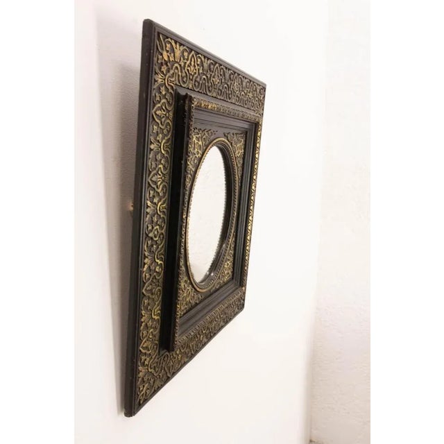 Napoléon III wood and stucco wall mirror painted of black and gold. During the Napoleon III period, artists had a keen...