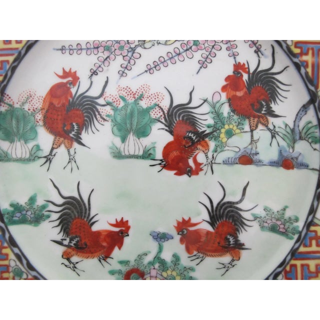 Japanese, but made in Hong Kong, 20th century porcelain plate, measures 10 1/2". White porcelain hand painted in bold...